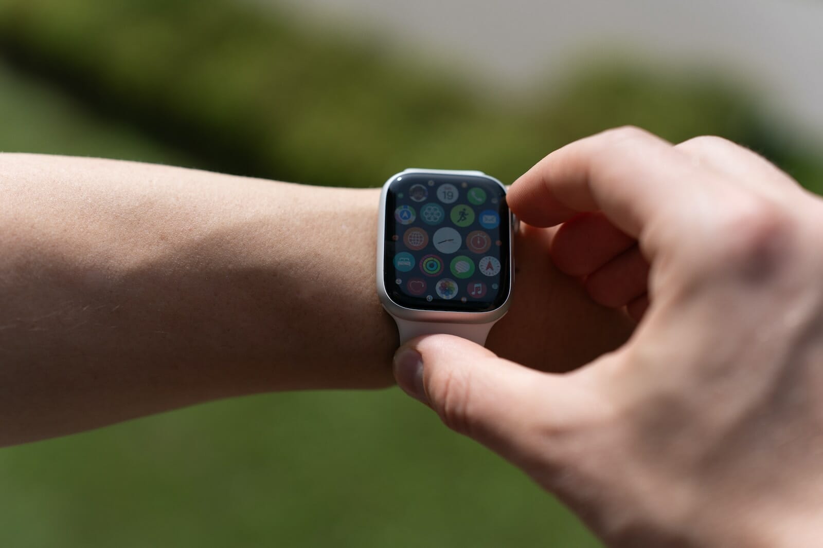 a close up of a person holding an apple watch