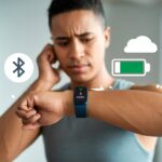 A person looking at their fitness tracker with a puzzled expression, showing no calories burned data on the screen.