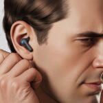 A person with Bluetooth earbuds slipping out of their ears, looking frustrated.