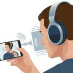 A person wearing Bluetooth headphones looking at a smartphone with a video on the screen, with visual effects suggesting a delay between the audio and video.