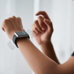 How to use a smartwatch for vibration alerts: Never Miss a Call—Unless You’re in a Bouncy Castle Close-up of a wrist wearing a smartwatch showing vibration alerts with subtle wave lines around the watch.