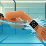 A person swimming in a pool wearing a smartwatch that shows swimming metrics on its screen.