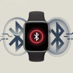 Smartwatch Bluetooth error code 45 meaning: Why Your Wrist Gadget Has Trust Issues Close-up of a smartwatch showing a red warning icon and broken Bluetooth connection symbols around it.