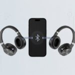 How to connect two Bluetooth headphones to one device and avoid sharing earbuds like a caveman A smartphone wirelessly connected to two pairs of Bluetooth headphones, one on each side.