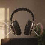 Why do my Bluetooth headphones not isolate sound? Maybe the World Misses You A person wearing Bluetooth headphones with a cutaway view showing internal parts and sound waves passing through the ear cups.