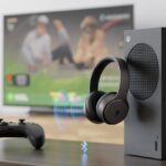 How to use Bluetooth headphones with Xbox: Because Wires Are So Last Decade A living room scene showing an Xbox console wirelessly connected to Bluetooth headphones with signal waves between them and a controller on a table nearby.