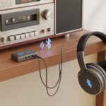 How to use Bluetooth headphones with an old stereo and finally escape tangled wires An old stereo system connected to wireless Bluetooth headphones via a small Bluetooth transmitter device.