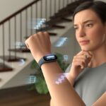 Why is my fitness tracker showing inaccurate floors climbed? Stairs, Sensors, and Silly Tall Tales A person indoors near a staircase looking at their fitness tracker on their wrist with a thoughtful expression.