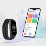 A fitness tracker connected to a smartphone displaying health data on its screen.